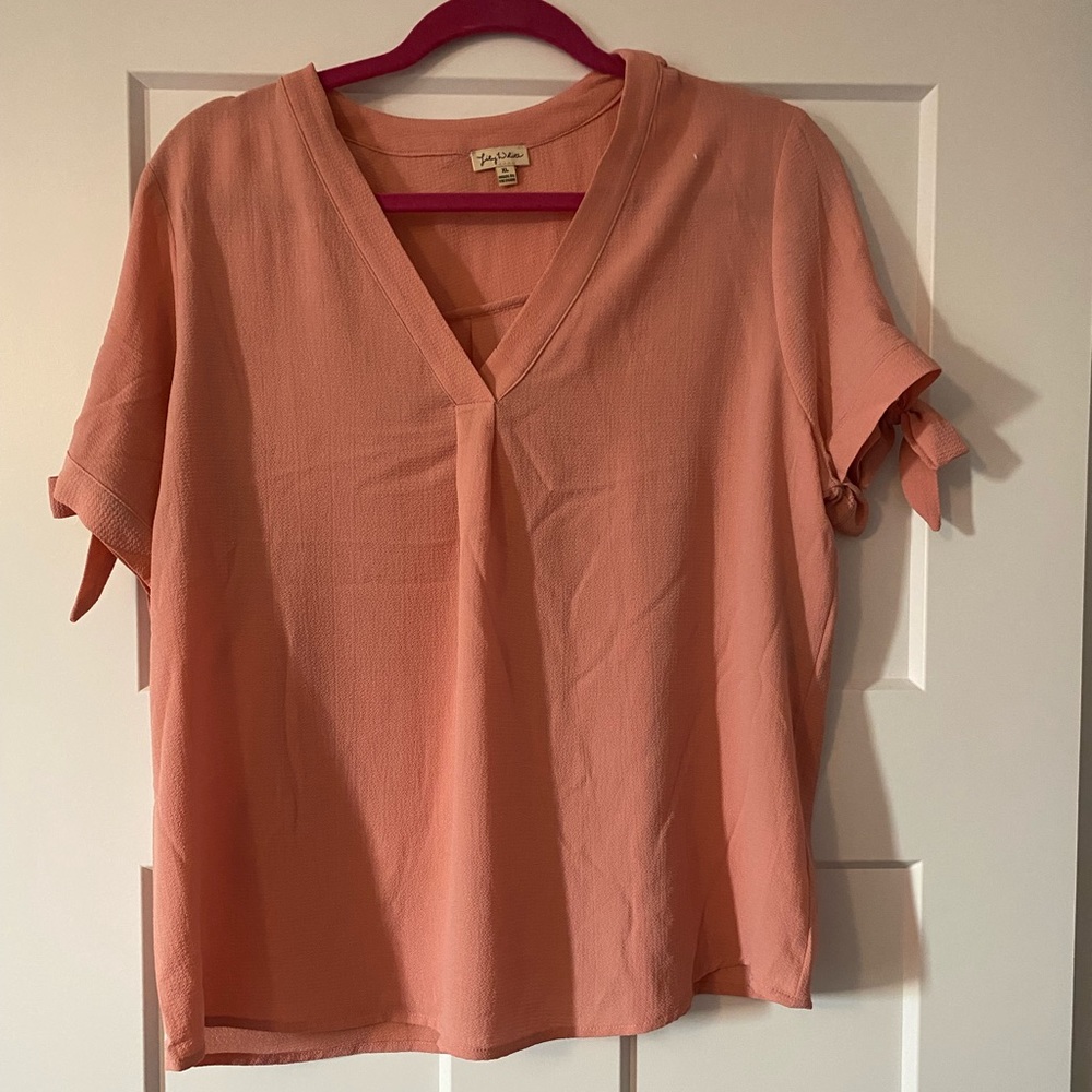 Pink blouse with tie sleeves